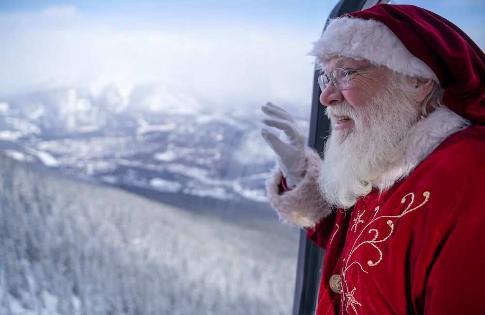 Santa looks out the window on the Banff Gondola in Banff National Park.